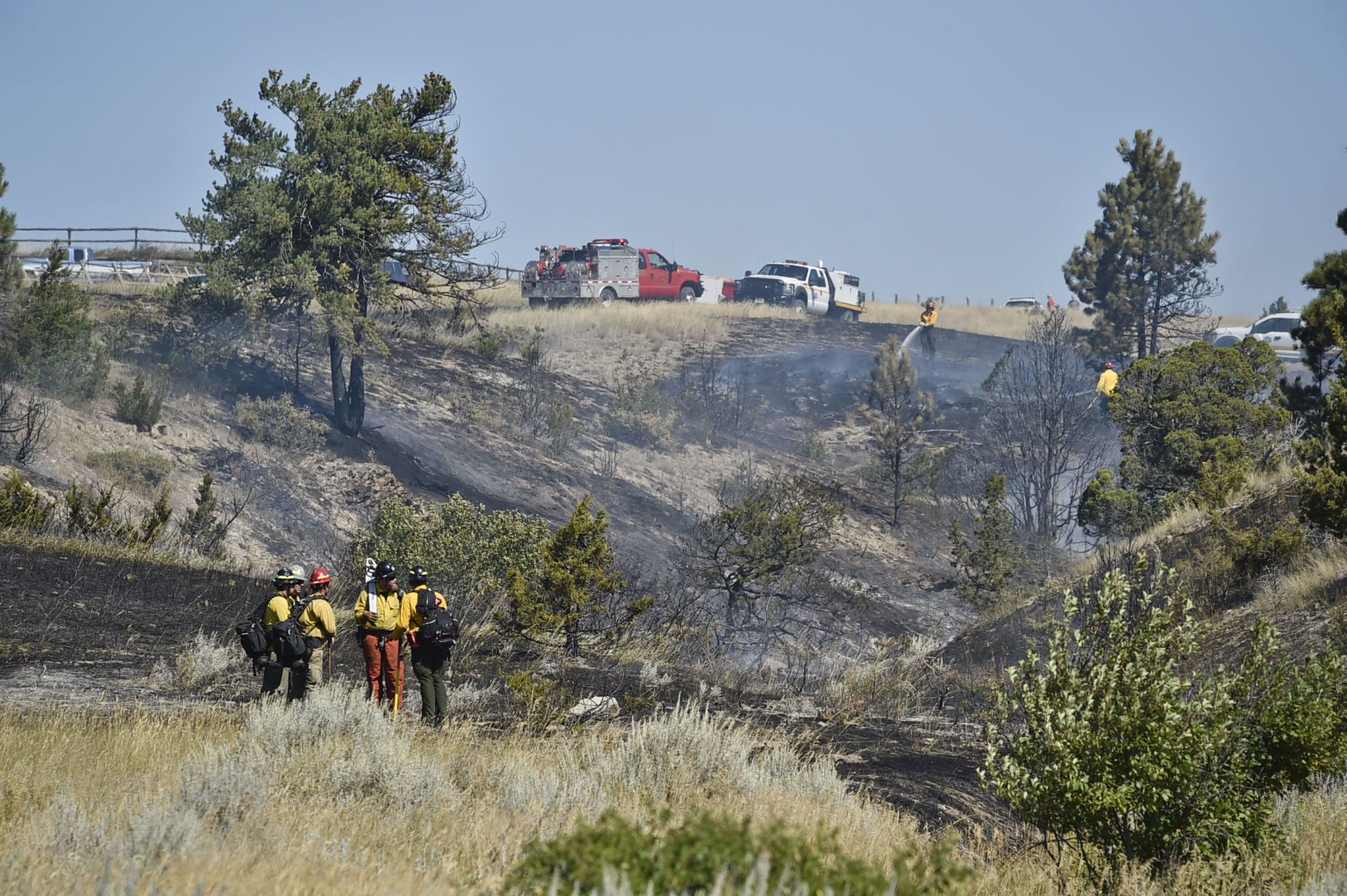 Firefighters attack multiple fires along Birdseye Rd. Wednesday afternoon.